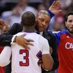 Clippers coach Doc Rivers hugs Chris Paul during a timeout Tuesday night. Robert Hanashiro/USA Today